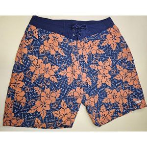 OP Board Shorts orange and blue floral design. Has a back pocket that closes sec